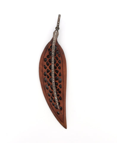 Carved wood and diamond feather Carved wood and diamond feather
