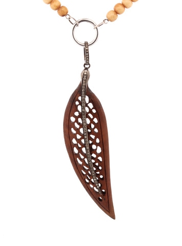 Carved wood and diamond feather Carved wood and diamond feather