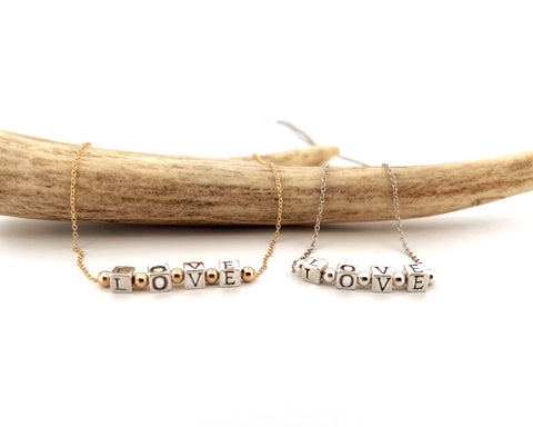 Silver and gold LOVE necklace Silver and gold LOVE necklace