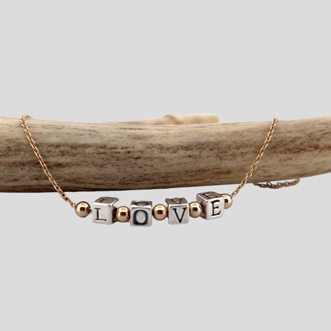 Silver and gold LOVE necklace